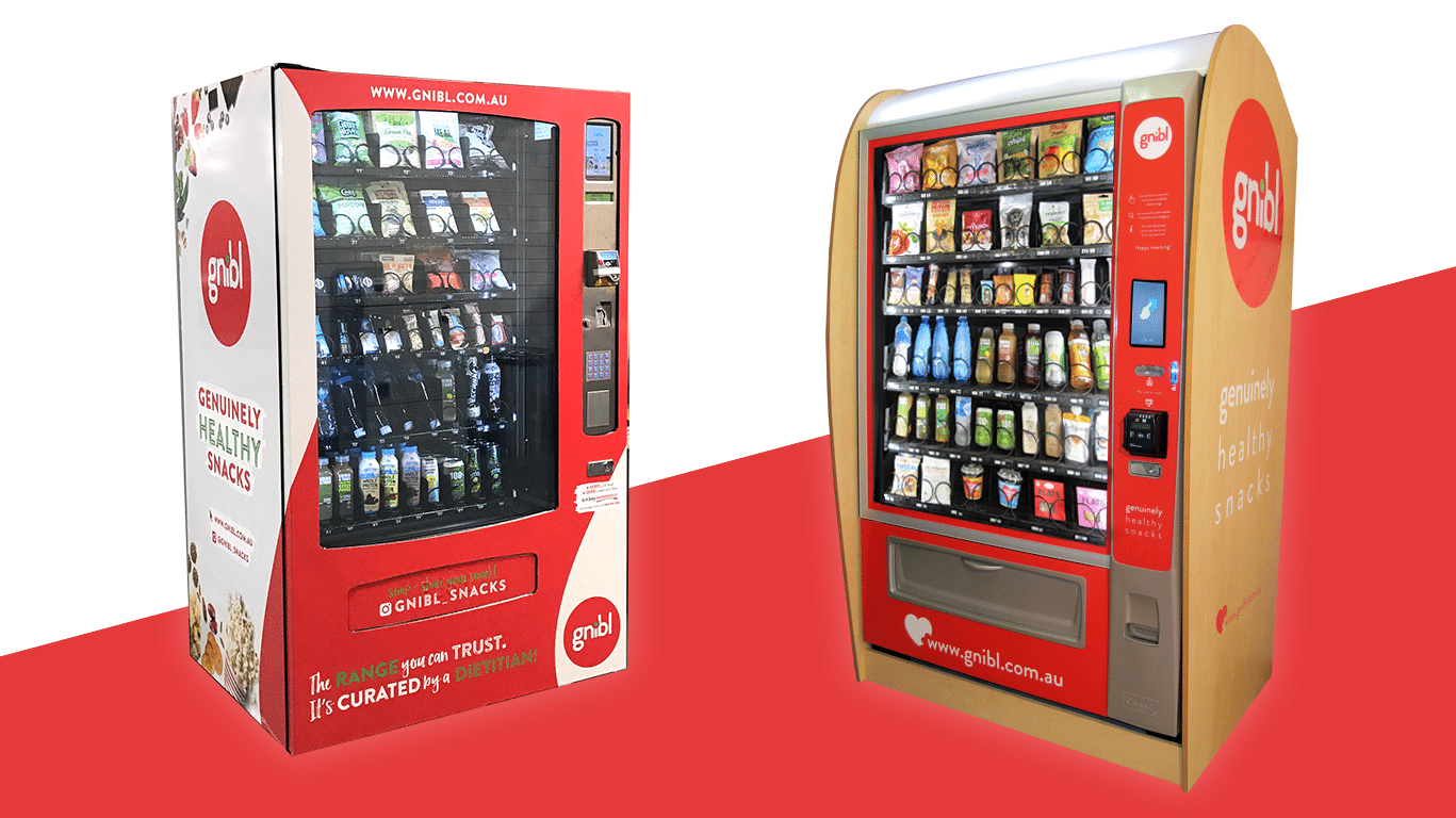 Two Gnibl vending machines that are fully stocked with healthy snack choices.